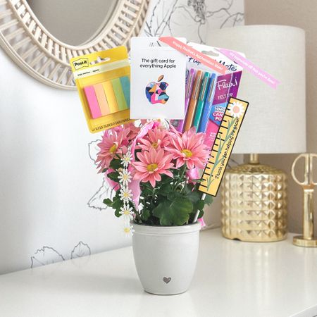 Easy, affordable & essential Teacher Appreciation Gift 🍎 

Gift flowers but include school supplies & a gift card too by attaching them to wooden dowel rods or skewers & push them into the pot.  

Add printables and fun ribbon to make tote gift even cuter!

#LTKunder50 #LTKGiftGuide #LTKfamily