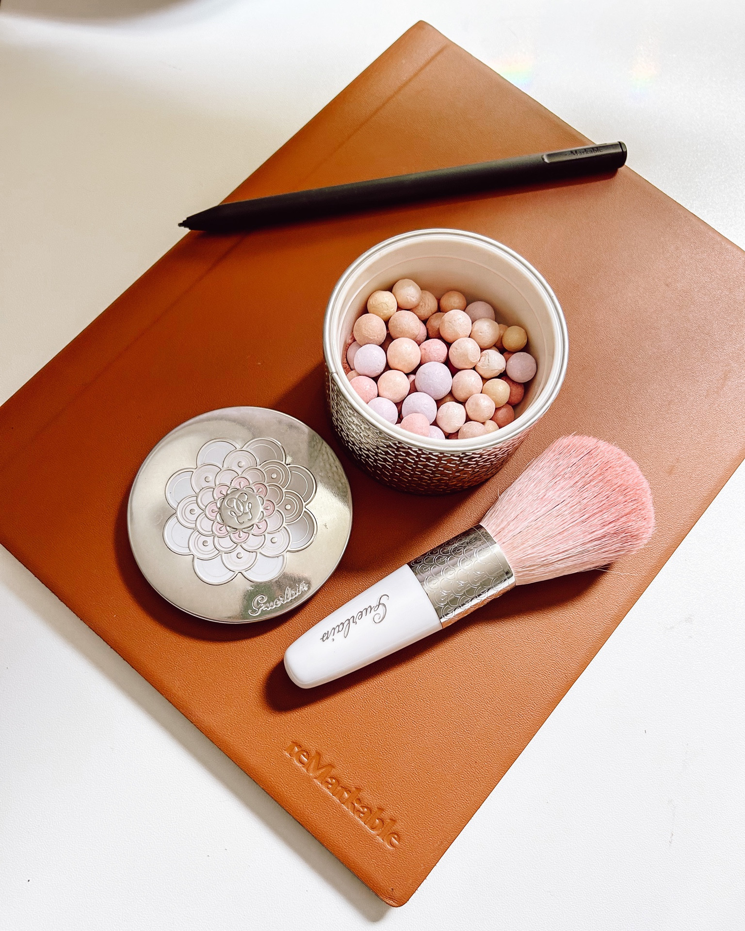 My workplace essentials. I would be lost without my Remarkable tablet. Perfect for lightweight business travel and for keeping my perfume notes and work notes separate, but also conveniently in the same place. 
Side note: I keep Guerlain metiorites in my desk drawer - sometimes because I genuinely need to powder my nose…but other times I just like to smell them. 

#LTKitbag #LTKaustralia #LTKbeauty
