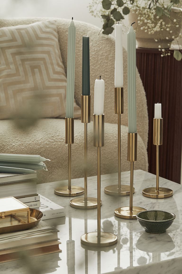 Tall metal candlestick with a round base. Height 11 3/4 in.CompositionStainless steel 100%Art. No... | H&M (US + CA)