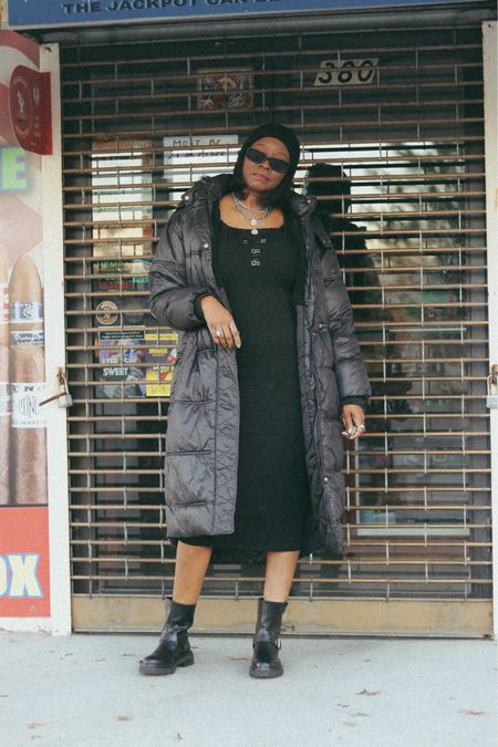 Black sweater dress and puffer coat with black bike boots 


#LTKstyletip