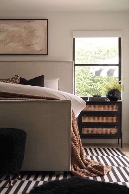 Bedroom decor 
Black nightstand 
Upholstered bed 
Striped rug 
Amazon rug 
Black throw pillow 
Spring decor 
Ottoman 
Amazon home decor 
#meandmrjones 


#LTKhome #LTKunder50 #LTKunder100