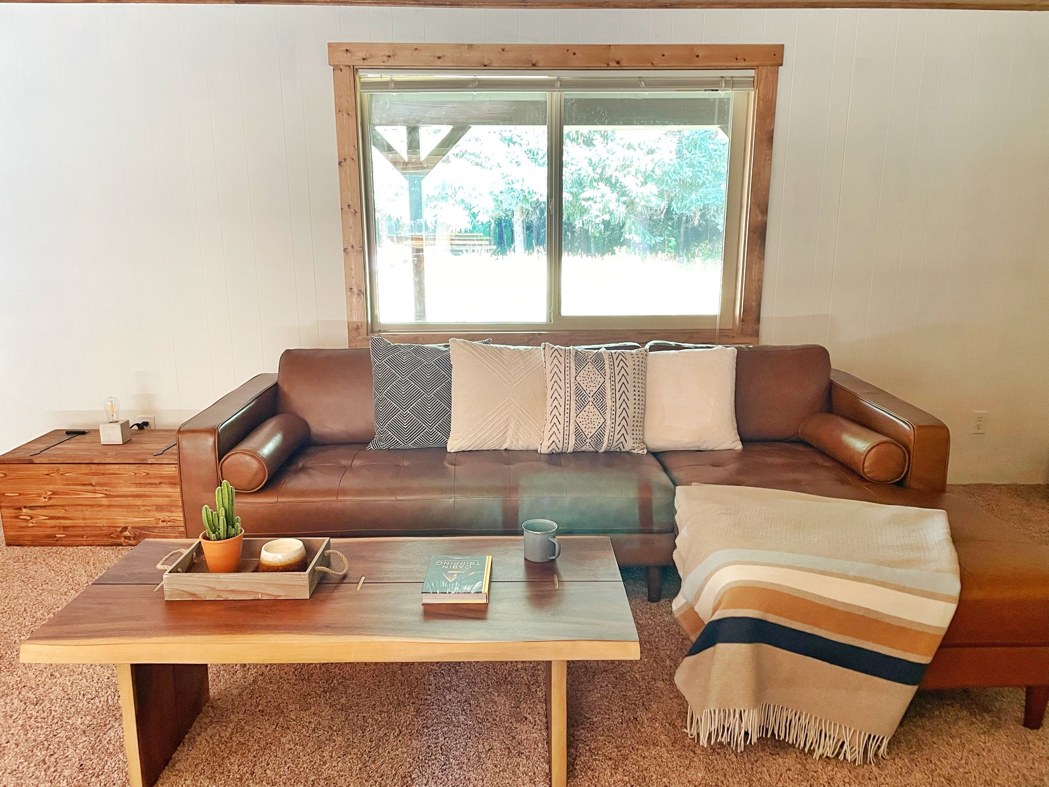 Cozy cabin living room - we love this couch for curling up to read a good book in the evenings 

#LTKover40 #LTKSeasonal #LTKhome