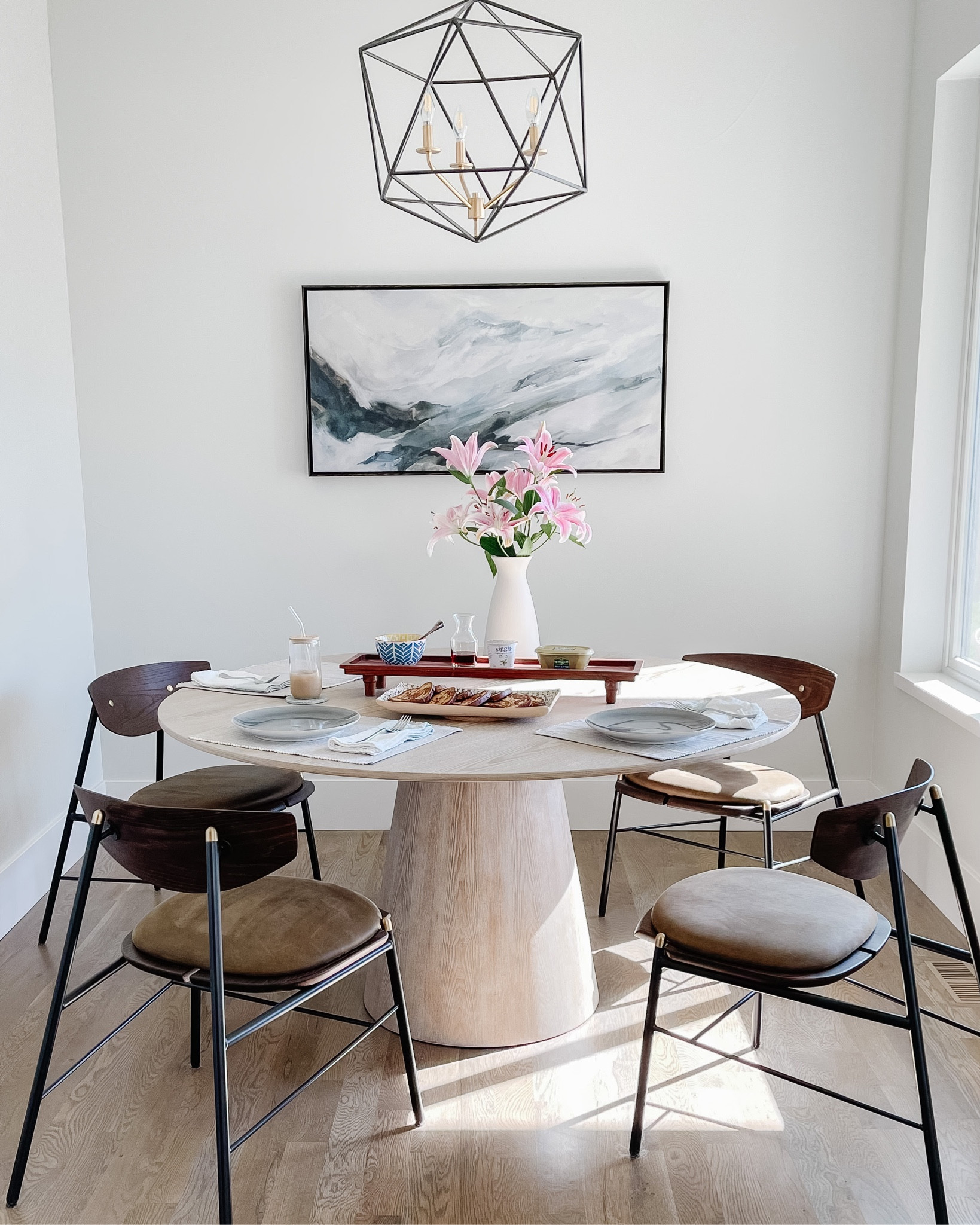 Dining room with brunch setup. Dining table and chairs, art, chandelier, vase

#LTKfamily #LTKSeasonal #LTKhome
