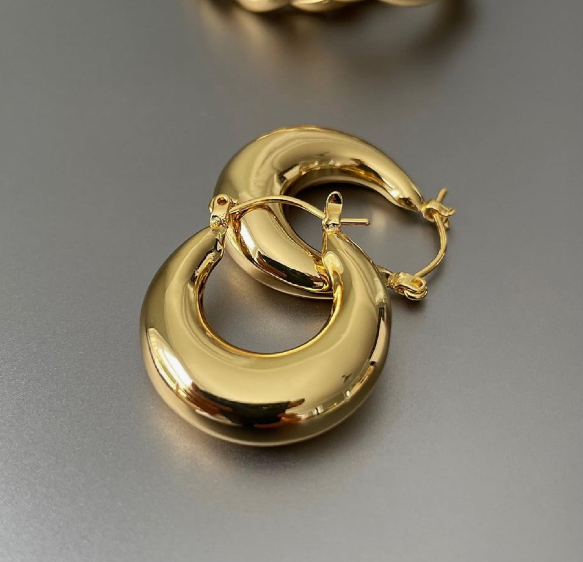 Bold and timeless, these chunky gold hoops add an instant touch of glamour to any look. ✨ 

#ChunkyGoldHoops #StatementStyle #GoldenGlam
#springstyle #springfashion

	1.	#ChunkyHoopEarrings
	2.	#GoldJewelry
	3.	#StatementEarrings
	4.	#JewelryLover
	5.	#FashionAccessories
	6.	#HoopEarrings
	7.	#GoldHoopStyle
	8.	#GlamourousAccessories
	9.	#EarringEnvy
	10.	#ShineBright