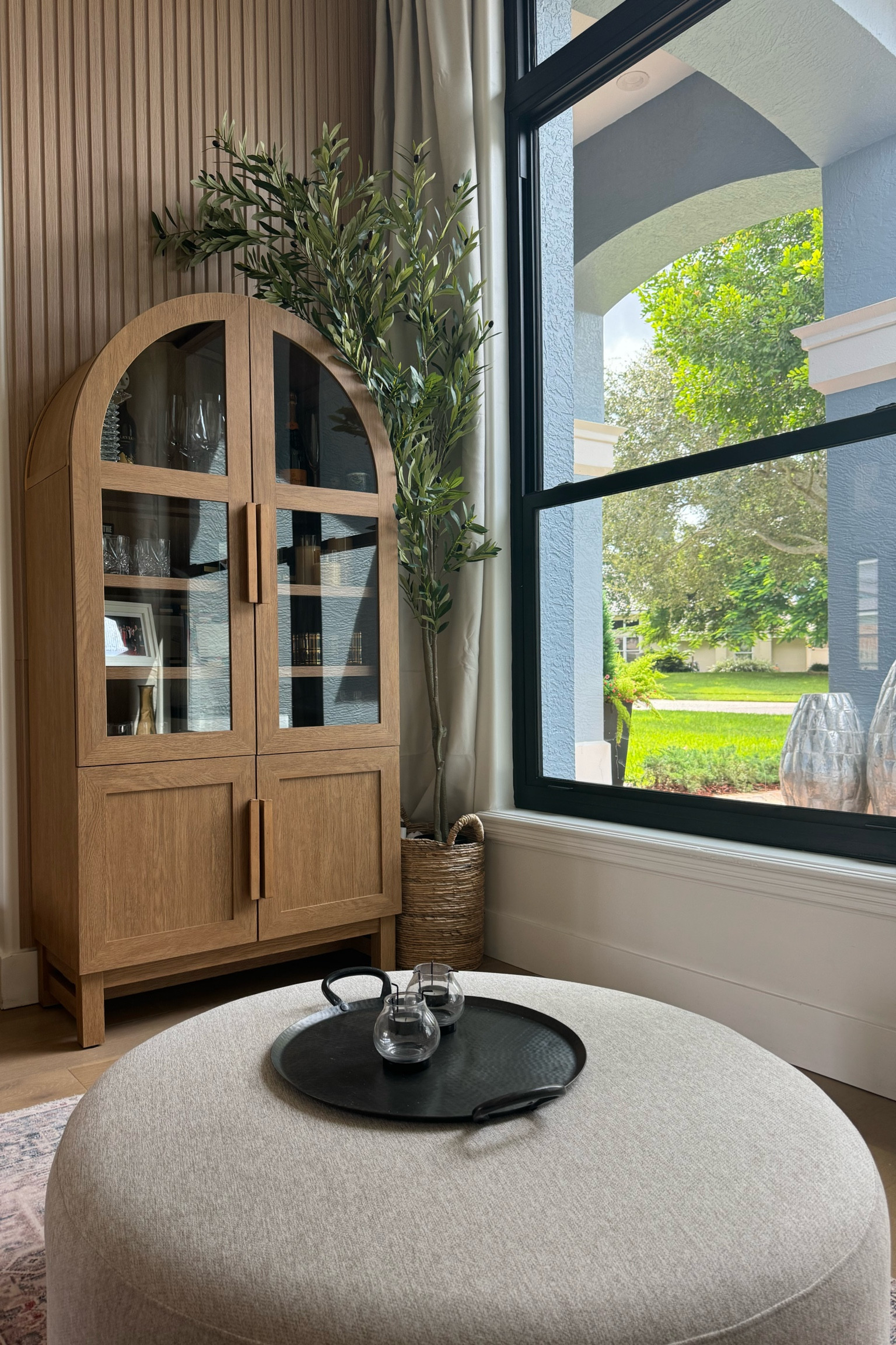 Walmart hutch !! 
Walmart ottoman
Walmart fashion 

Better Homes & Gardens Juliet Kitchen Rounded Solid Wood Frame Arc Cabinet, Light Honey Finish

Walmart round cream microfiber ottoman
Crate and barrel tray 
Target chunky knit throw 
Amazon black out curtains 