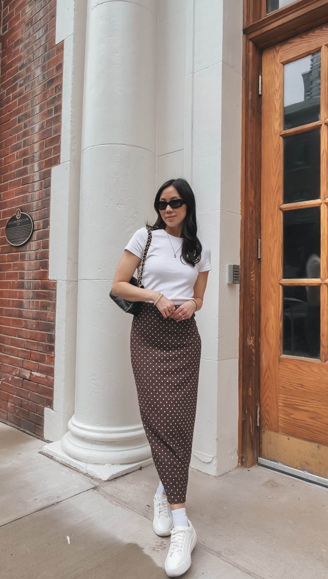  The Best White Tee for Summer — Aritzia Homestretch
The Aritzia Homestretch tee is the white tee that makes everything look more expensive. The fit is the thing — slim, clean, not boxy, not see-through. Styled here under a caramel knit draped at the shoulders with a chocolate polka dot maxi skirt. It's the kind of basic that quietly carries every outfit. Linked here with similar options.

 

#LTKSaleAlert #LTKWorkwear #LTKSeasonal