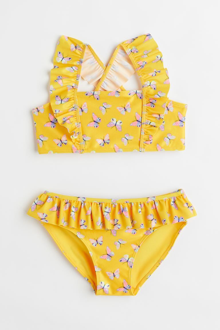 Conscious choice  Fully lined, patterned bikini. Top with ruffle-trimmed shoulder straps crossed ... | H&M (US + CA)