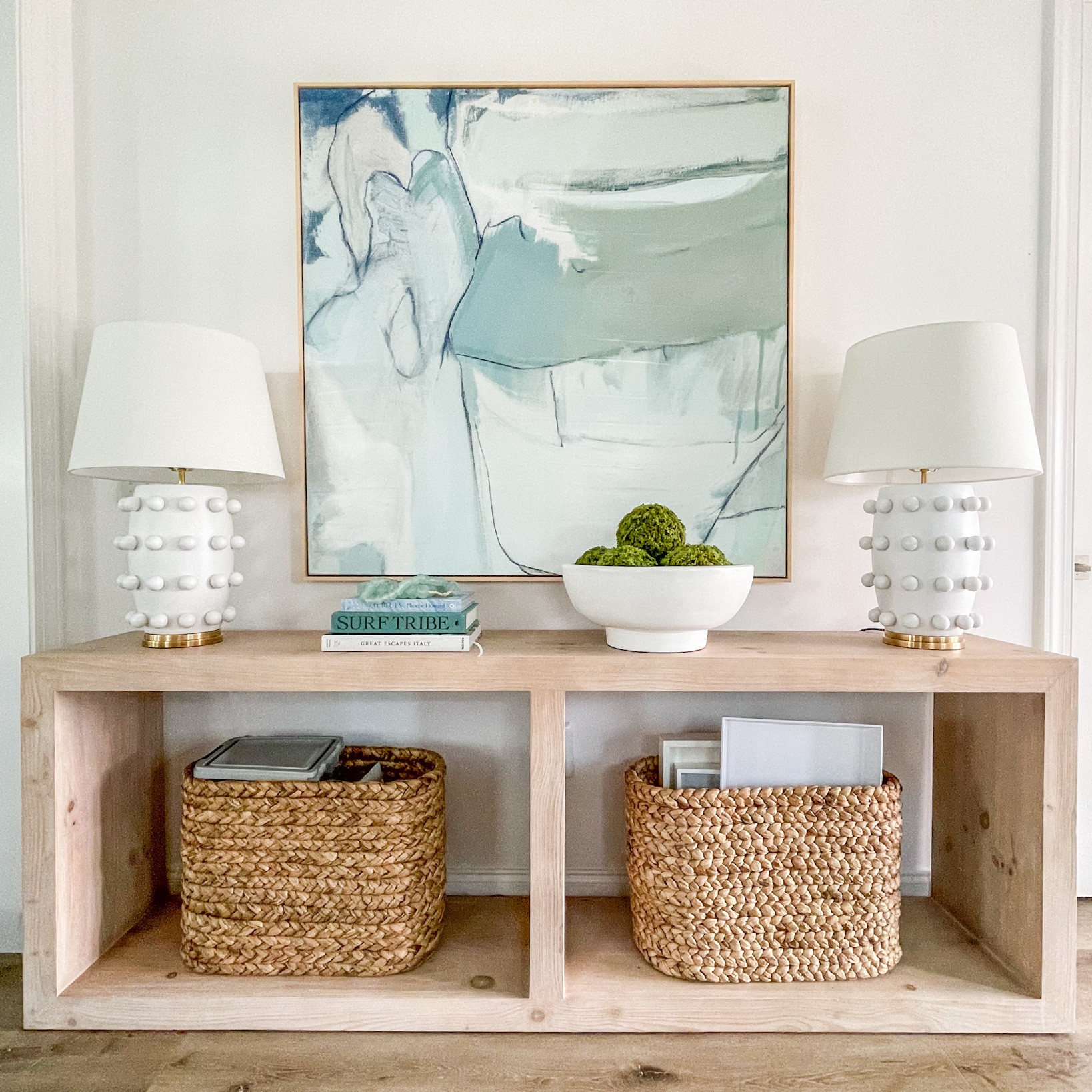 I did a quick cleanup of our dining room console table today! Our outlet is right behind the center post and would push the table out if I plugged in the lamps. So, I found this slim outlet cover that allows you to plug your lamps in in a secret spot! Also linking our long console table, circle dot lamps (and a good look for less option), abstract art, seagrass baskets (they hold the cat food and trays), and my large ceramic bowl filled with moss balls.
.
#ltkhome #ltksalealert #ltkunder50 #ltkunder100 #ltkstyletip #ltkseasonal #ltkfind

#LTKhome #LTKSeasonal #LTKsalealert