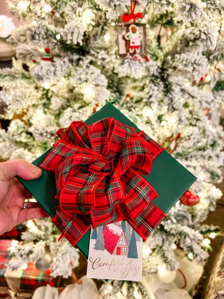 Easiest way to make bows ever! ✨🎁 I just wrapped the ribbon over itself 6-8 times, made notches to tie it down on each side of the middle, tied it down in the center, and then pulled the pieces apart to make the bow. 

#LTKGiftGuide #LTKHoliday #LTKSeasonal