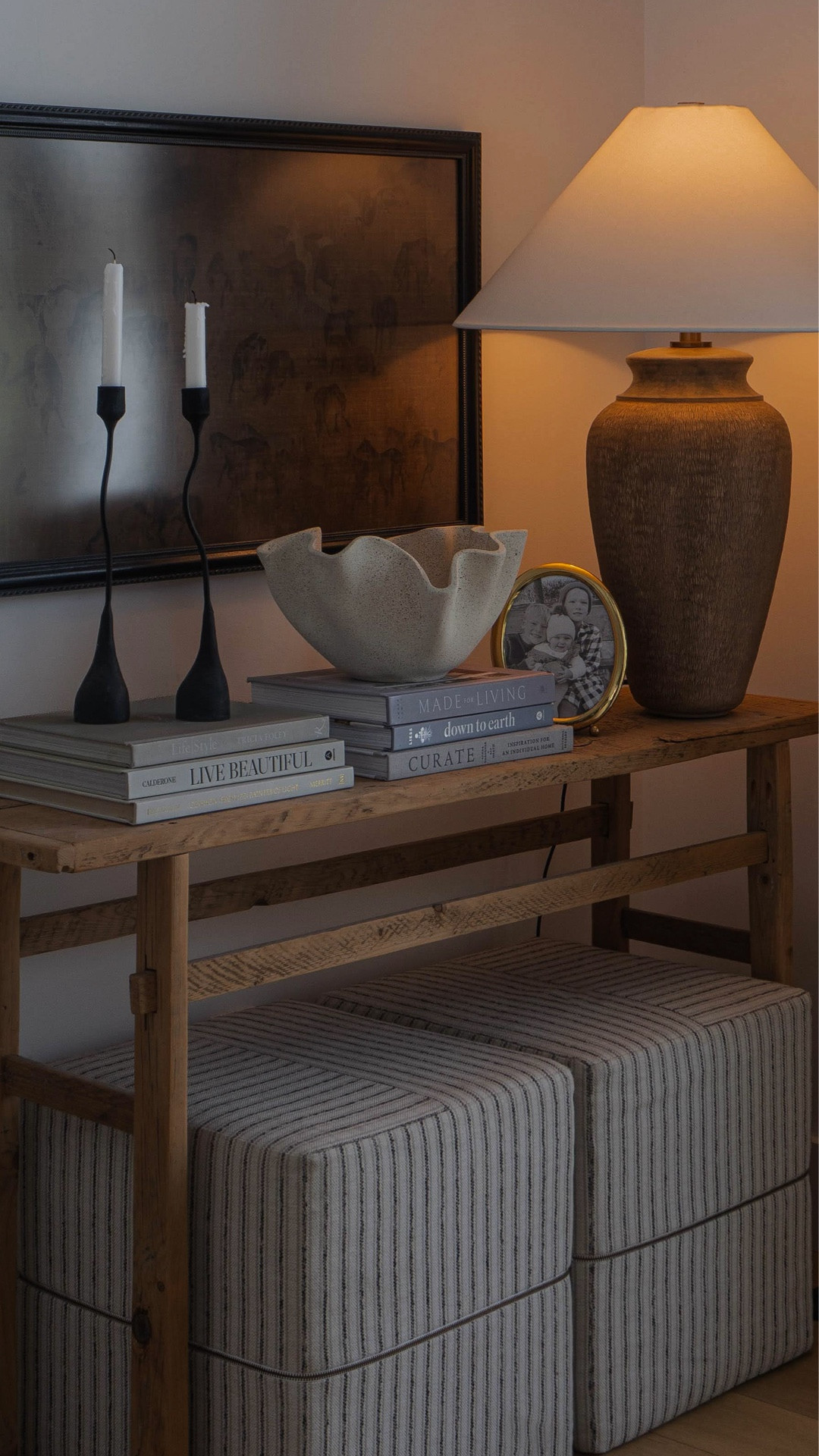 Keeping this console simple feels right — a few favorite books, classic artwork, a soft table lamp for a warm welcoming glow, and ottomans for texture and comfort. This elm wood console is a piece I’ve loved for years, a reminder that the simplest things never go out of style 🤍

#entrytable #consoletable #entrydecor #consolestyling #vintagefurniture #wayfairCaPartner #wayfaircanada #neutraldecor #reclaimedwoodtable #woodtable #tablelamp #troylighting #coffeetablebooks #artwork

#LTKHome #LTKSaleAlert #LTKSeasonal