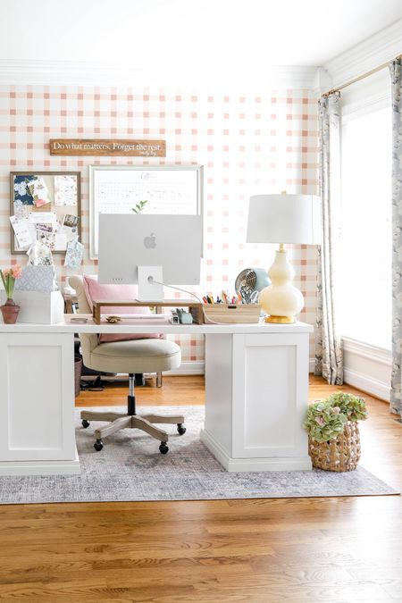 My office desk sits in the middle of the room on an area rug. My desk is on risers and my desktop computer is on a stand in order to keep my computer at eye level.

#LTKhome