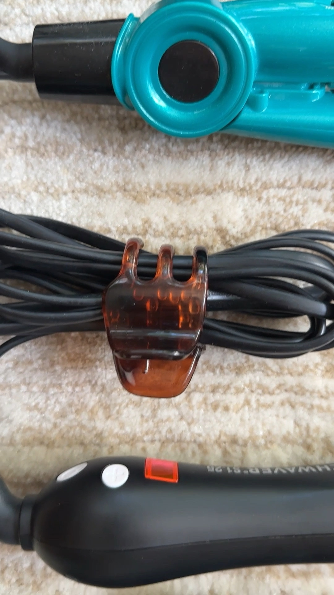 Organization hack for hair tools: use your hair clips for cord management so you already have them on hand for styling