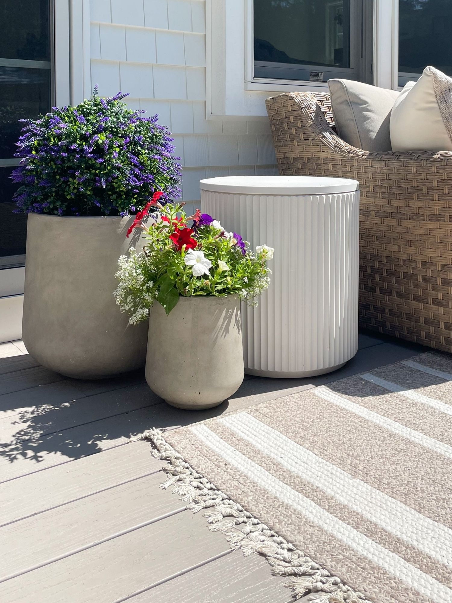 Coastal patio styled with neutral outdoor planters, artificial lavender plants, woven patio furniture, and striped outdoor rug for relaxed outdoor living.

coastal patio decor, neutral outdoor planters, artificial lavender plants, striped outdoor rug, woven patio furniture, outdoor coastal styling, neutral patio decor ideas, backyard patio styling, sherricalnanhome

#LTKHome #LTKSeasonal