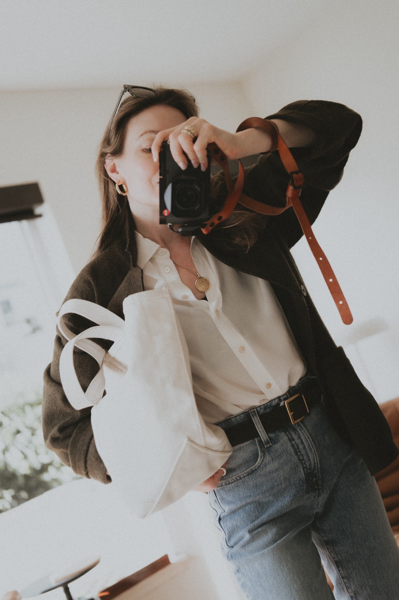 All about the details: high rise denim, square buckle belt, statement jewelry, canvas bag, felted wool jacket, silk blouse. 
Blouse: Everlane
Bag: L.L. Bean
Jeans @Madewell 
Jacket: Buck Mason
Jewelry: David Yurman & Mejuri

#LTKootd #LTKWorkwear