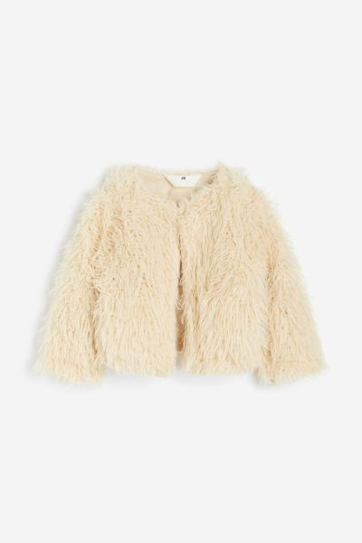 Boléro à poils longs | H&M (FR, IT, ES, PT, BE)