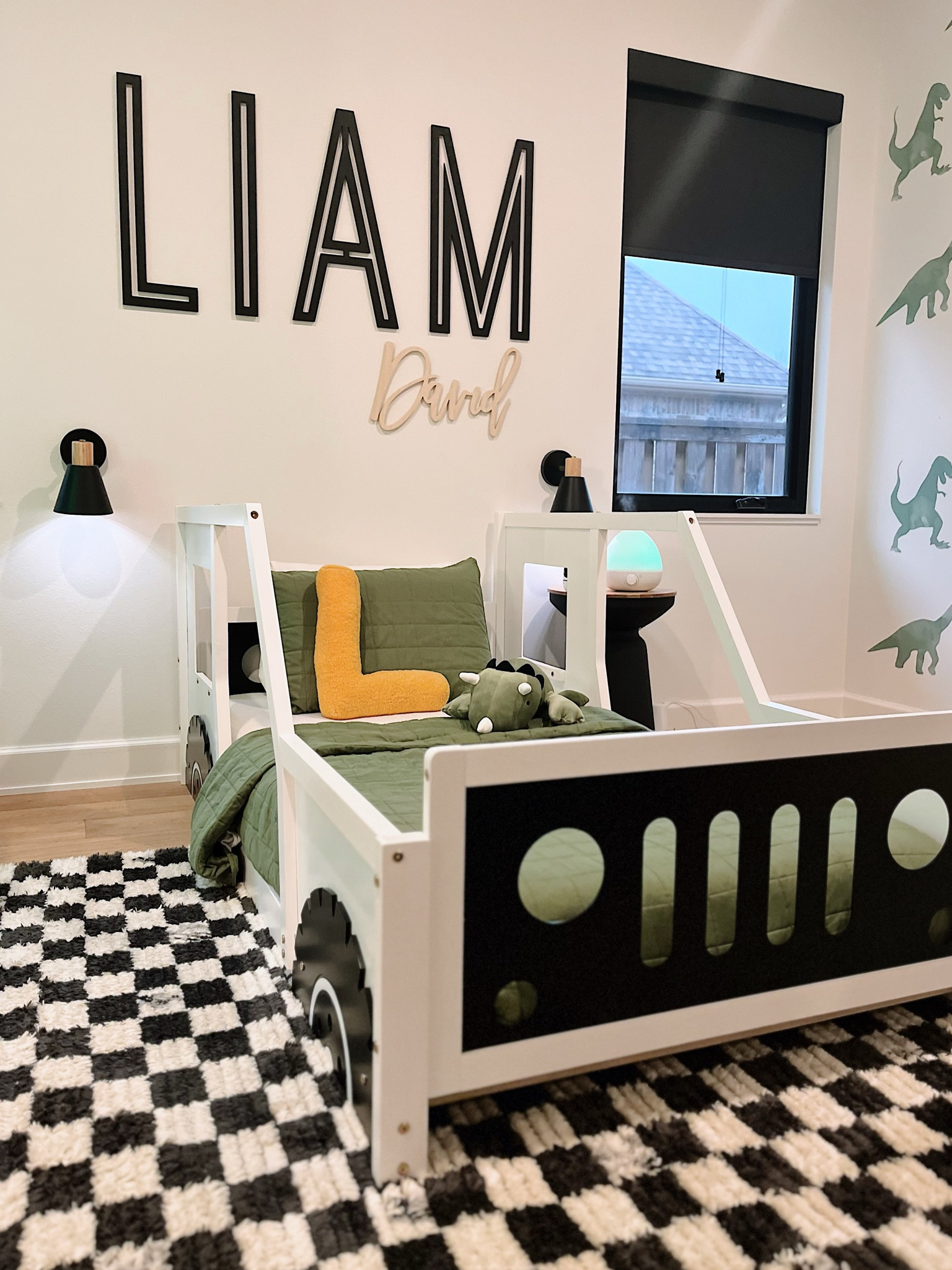 Toddler boy room 🦖 
#toddlerroom #dinoroom #carbed #toddlerboystyle #moderntoddlerroom #nurseryupgrade #cherkeredrug #greenandblackdesign #toddlerdesign #dinosaurroom #walldecals 

#LTKhome #LTKbaby #LTKkids