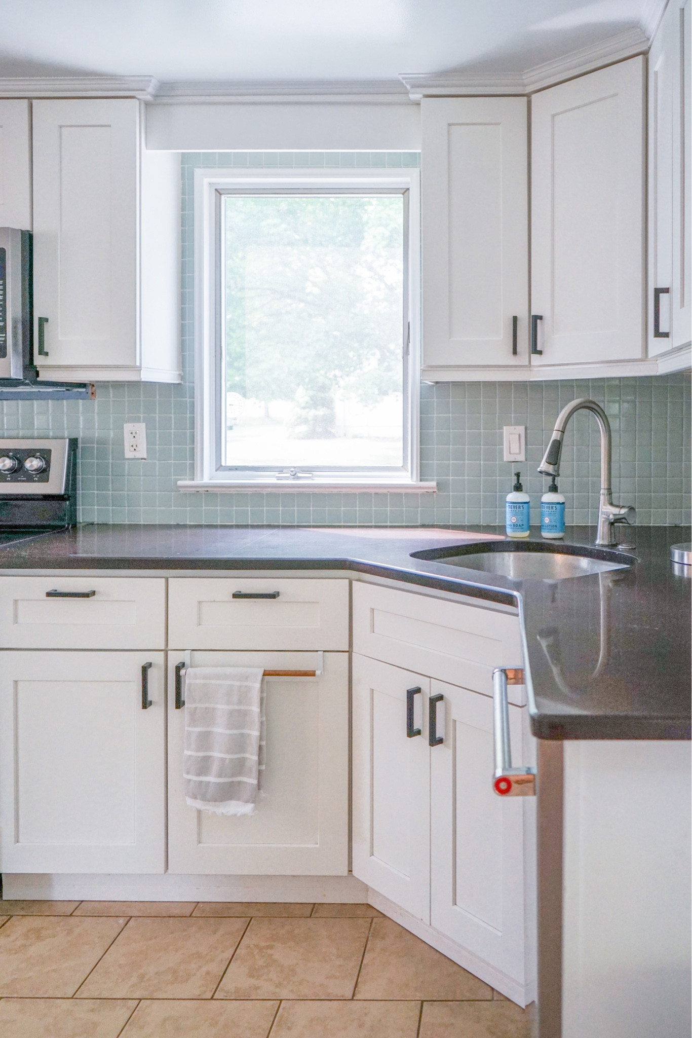 Everything we used to paint our backsplash!

Used color River Mist of the Floor Coat and ended up grouting lightly on top. But you could also trace the grout line with a paint pen!