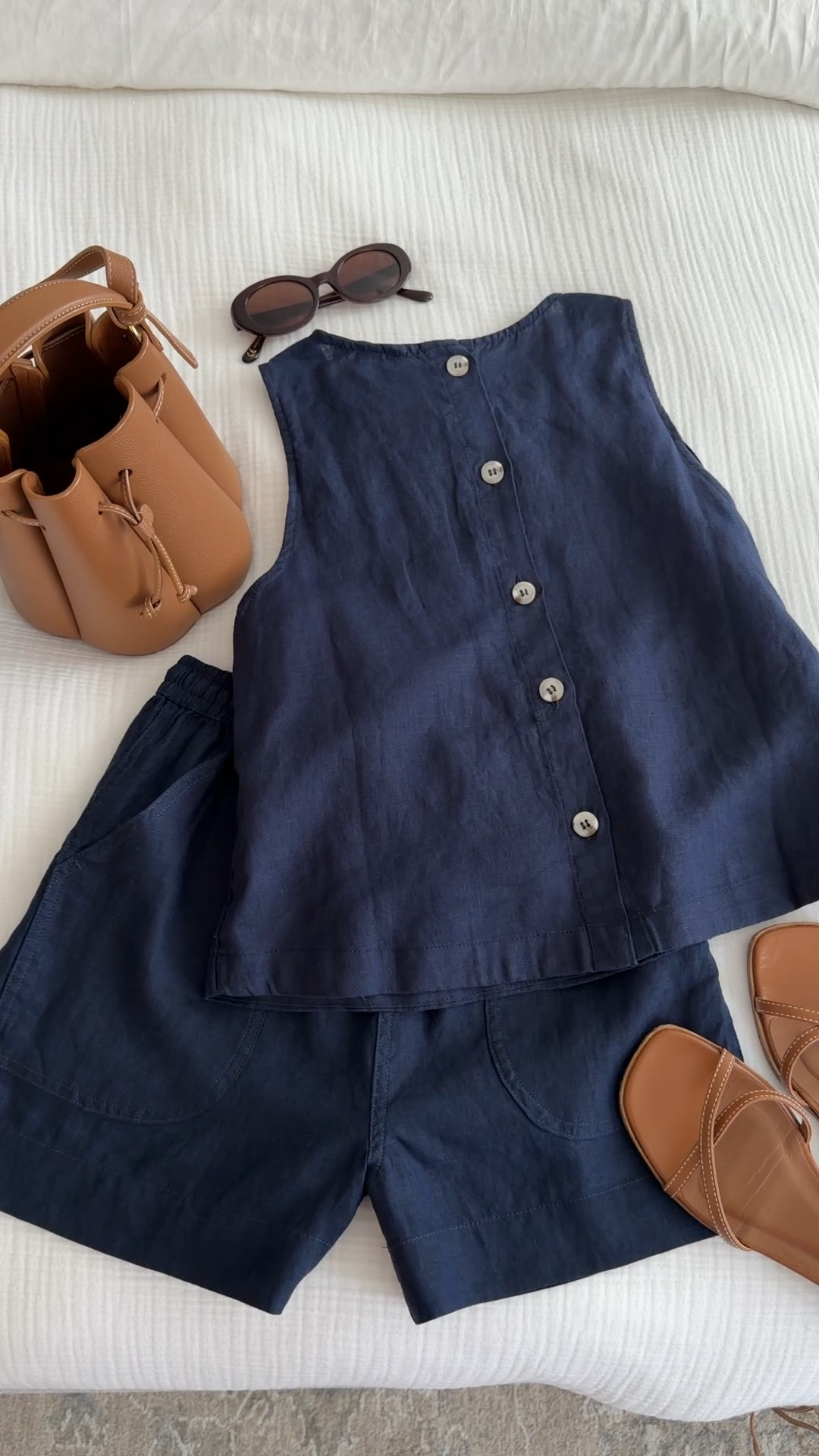 100% linen set from quince in XS also love this in gingham! Buttons are on the back. 
Both are a little loose on me but can shrink slightly in dryer and shorts have drawstring to help with fit

• Margaux wrap sandals 5
• Polene bag old linked similar
• Madewell sunglasses

Easy summer mom outfits, travel friendly, breathable style for hot weather

#LTKPetite #LTKTravel