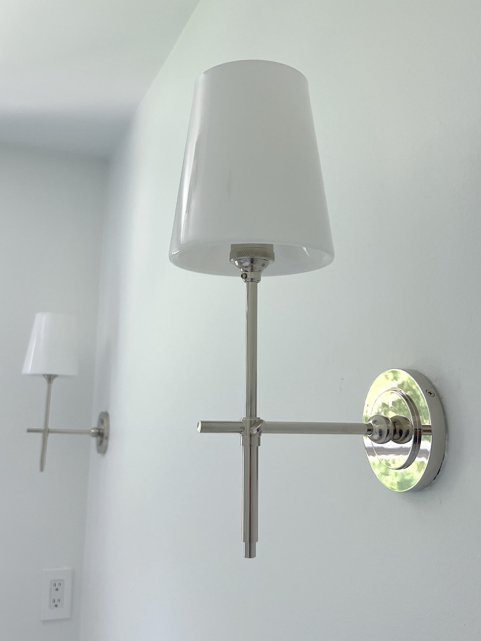 Loving these traditional & elegant polished nickel bathroom sconces with milk glass shades for our luxury bathroom remodel. Opted for sleek and minimal outlet covers that conceal all of the screws for a super clean and modern yet minimal look. 

#LTKHome