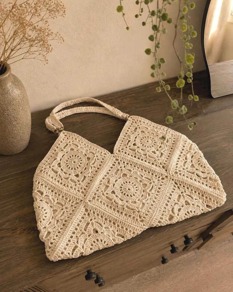 This crochet tote is giving ALL the summer vibes and I’m obsessed 🤍✨ Handmade, fully lined, boho perfection! The craftsmanship on this bag is chef’s kiss and it goes with literally everything from maxis to denim cutoffs.

#CrochetBag #CrochetTote #BohoBag #HandmadeBag #SummerBag #BohoStyle #EtsyFinds #EtsyFashion #HandmadeHandbag #CottonBag #ShoulderBag #BohoFashion #SummerAccessories #BeachBag #WovenBag #ArtisanBag #EtsySeller #StyleInspo #OutfitOfTheDay #FashionFinds #LTKfinds #LTKbag #LTKstyletip #LTKunder500