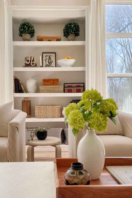 Organic Modern family room, neutral tones, cozy living, pottery, faux hydrangeas, chair slipcovers, wood boxes, budget friendly home decorr

#LTKHome #LTKFindsUnder50 #LTKStyleTip