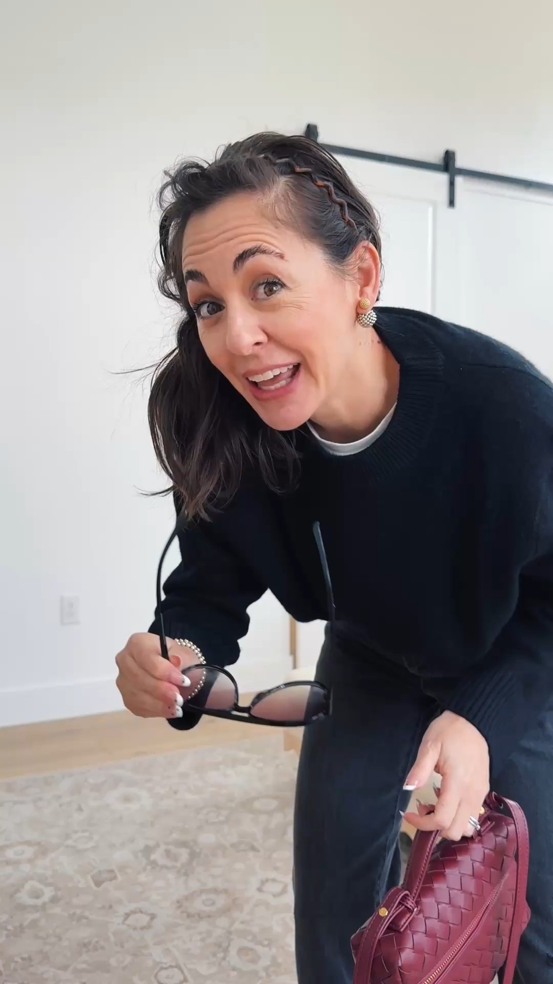 I am 5 foot four and wearing an extra small in this oversized, cashmere sweater and size down in this modified barrel leg in regular length 