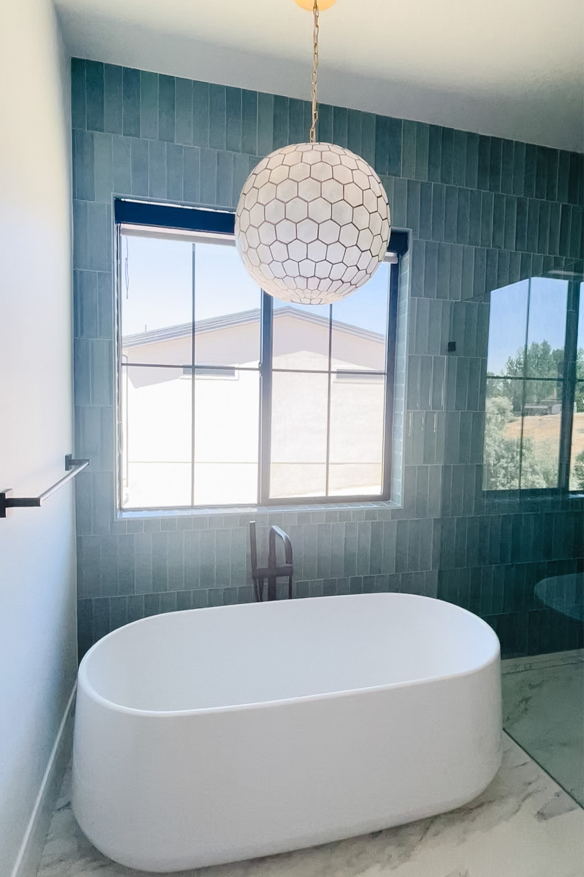 We love our blue tile in our bathroom! Not only is the color nice but the tile has a reflective surface that catches the light beautifully!

#LTKfamily #LTKhome
