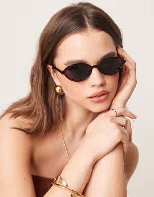 ASOS DESIGN slim oval sunglasses in crystal brown | ASOS (Global)