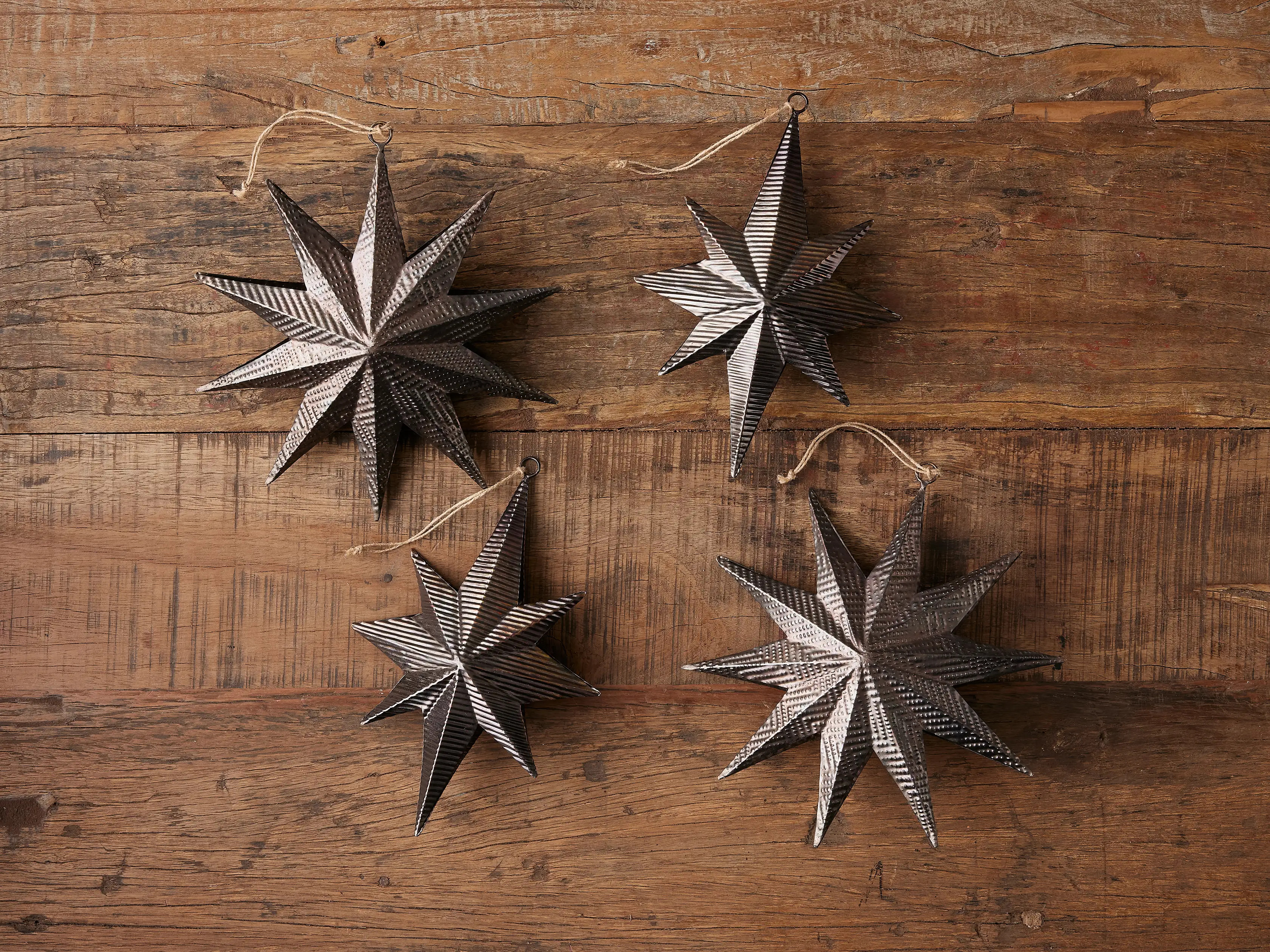 Embossed Star Ornament in Dark Bronze (Set of 4) | Arhaus