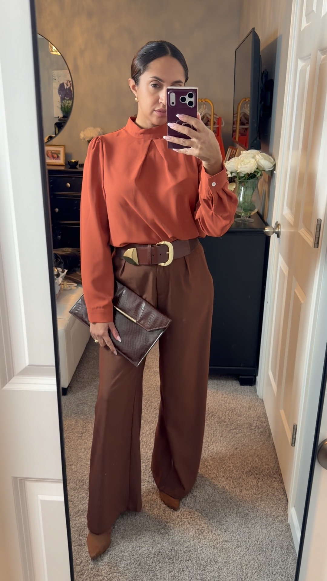 Here’s what I wore to work today. I paired a rust colored blouse with brown wide leg pants tied it all together with a brown belt, brown boots and a vintage animal print brown purse. The colors complement each other so well and it’s just a nice, sleek, put the other look for the office 🧡🤎

#LTKgrwm #LTKOver40 #LTKWorkwear