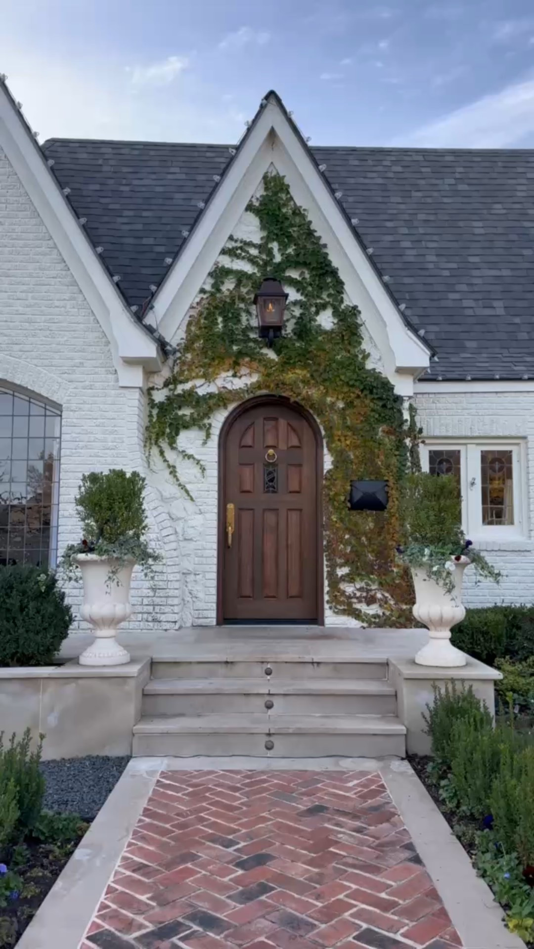 EXTERIOR TRANSFORMATION

The white paint color is Greek Villa by Sherwin Williams. 

Our home is an almost 100 year old Tudor. I love a house with curb appeal & this one had all the right bones, it just needed a little updating. I feel like this shows the power of landscaping & paint. It can make SUCH an impact. I’m SO excited to see our ivy continue to grow & thrive around our front door. It makes me SO happy! 

I keep debating about painting the trim around our windows a muted color for some contrast. What do you think!? 

#oldhouse #oldhome #100yearoldhome #tudorhouse #exterior #curbappeal #exteriortransformation #homerenovation #homebeforeandafter #beforeandafter #transformation #hometransformation #homedecor #dreamhouse #dreamhome #home #aloabode #tudorstyle 