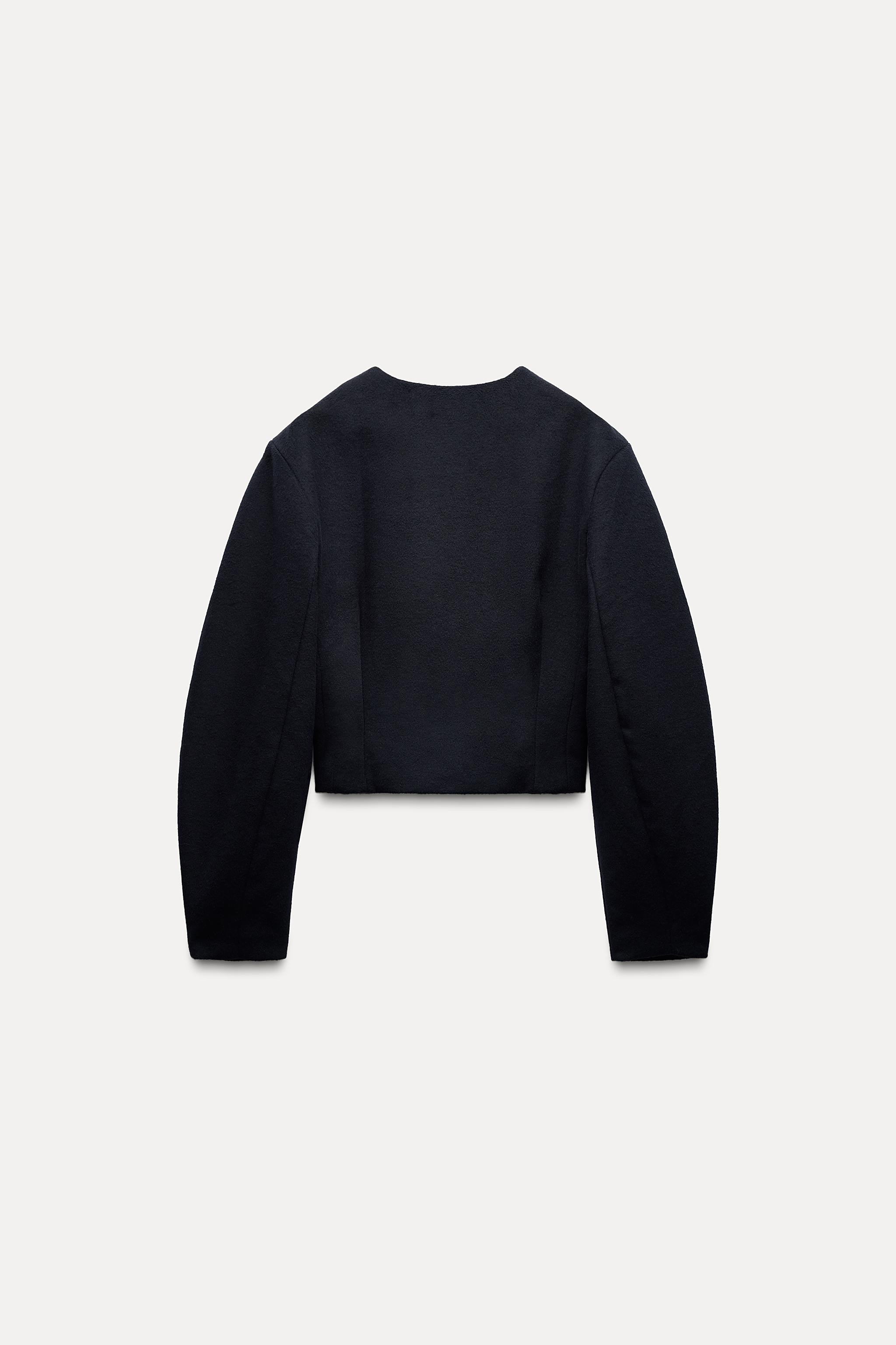 Jacket made with 15% wool. Round neck and long balloon sleeves. Front flap pockets. Lined. Covere... | Zara UK