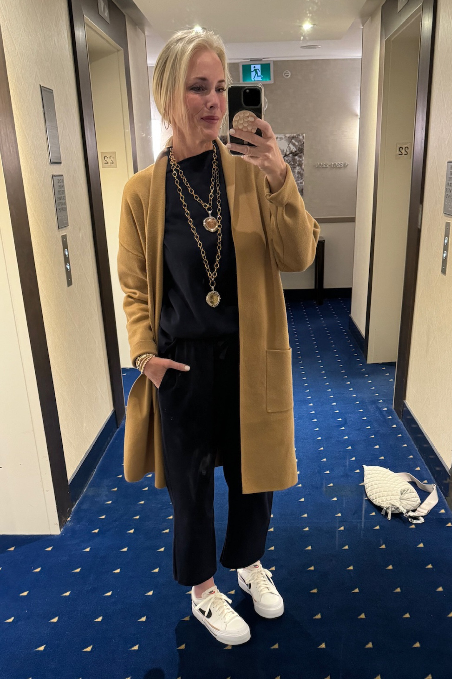 For travel day 5, I'm keeping it cozy and chic with this navy lounge set, a fabulous Frank and Eileen Look For Less. Topped it off with a cozy long coat and my favorite Nike court legacy lifts. 

Accessories are key, so I’ve got my Mz Wallace sling bag for all the essentials and my go-to jewelry pieces from Amazon, Loft, Victoria Emerson, and Jennifer Ponson. ✨ 

If you use my link for Jennifer Ponson, when you get to the checkout part, put Lauren10 for the coupon code. If you put Lauren10, then hit
"apply" then type in "freeship," and hit "apply," you will get free shipping in addition to 10% off.  https://www.jenniferponson.com/discount/Lauren10 

Shop my entire look and get ready for your own stylish adventures! 🌟

#LTKTravel #LTKOver40 #LTKStyleTip