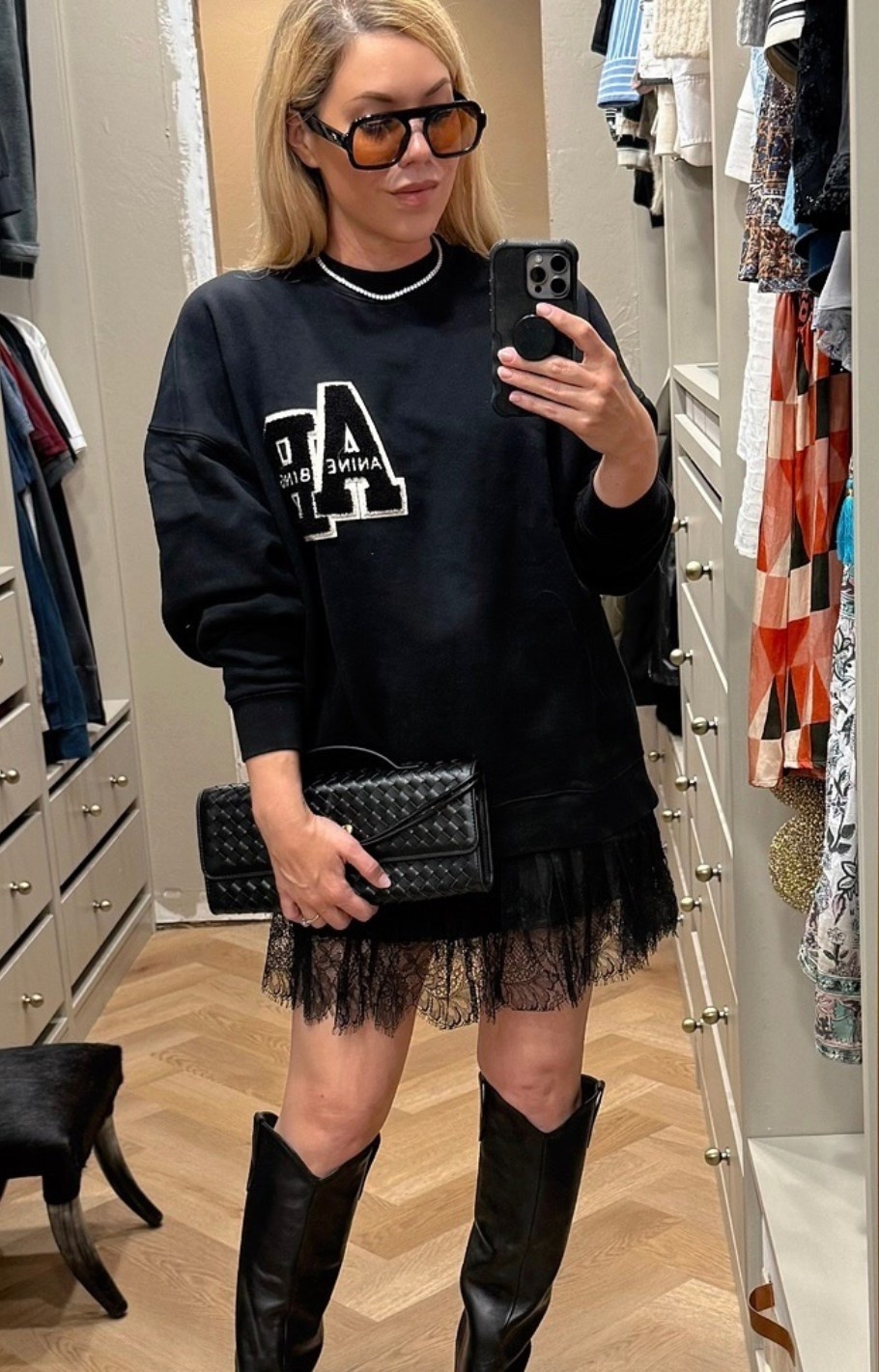 Anine Bing sweatshirt 
Lace skirt
Western boots 

#LTKSeasonal #LTKFindsUnder50