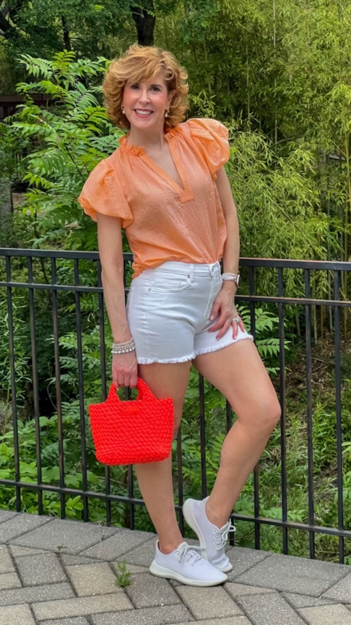 How cute is this darling orange puff sleeve top from Avara! It's somewhat sheer, but I'm wearing it with a nude bra, and you can't see a thing! The deep v-neckline and ruffle collar are so flattering, and it's so lightweight and breezy, it'll be perfect for our steamy Dallas summer! It fits TTS.
🧡🤍
My stretchy white shorts are from Avara also and they come in S,M, or L and fit TTS! I normally wear a size 2 in bottoms, so I'm wearing a small in these.

Use code SUZY15 for 15% off sitewide @shopavara !

My lightweight white sneakers are linked below as well as my pearl Apple Watch band and bracelet stack!


#LTKfindsunder100 #LTKover40 #LTKVideo