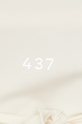 The Wrap Top in Creme | Revolve Clothing (Global)