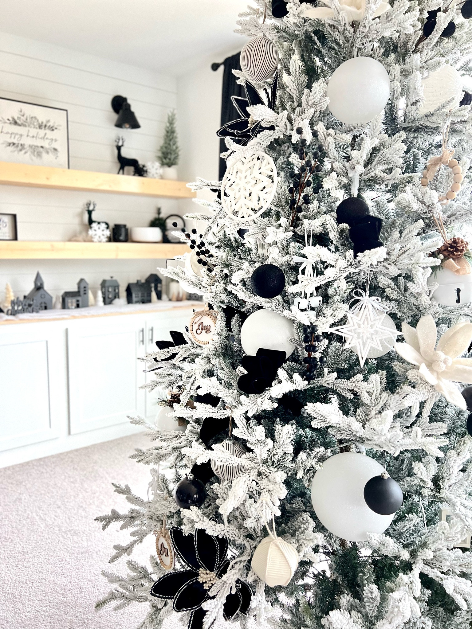Winter Wonderland 2022. Black, white and oversized. I absolutely love my tree this year. I went with a 9 foot flocked tree. 

#LTKhome #LTKHoliday #LTKSeasonal