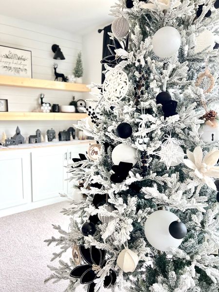 Winter Wonderland 2022. Black, white and oversized. I absolutely love my tree this year. I went with a 9 foot flocked tree. 

#LTKhome #LTKHoliday #LTKSeasonal