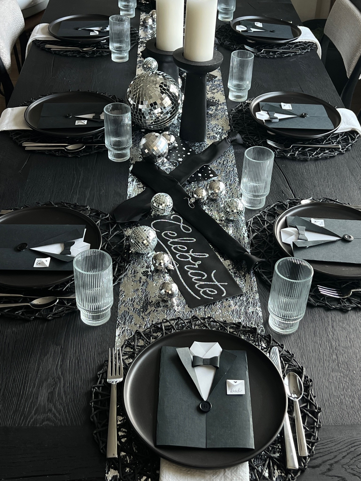 Father’s Day tablescape, Father’s Day table decor, masculine table decor, modern tablescape, black tablescape, matte black dinnerware, black dinner plates, woven charger plates, neutral linen napkins, textured table runner, black and silver decor, disco ball decor, mirrored ball decor, ribbed glassware, pillar candles, black candlesticks, elegant table setting, modern entertaining, dinner party inspiration, hosting inspiration, personalized place cards, tuxedo place cards, DIY place cards, elevated hosting, contemporary home decor, moody tablescape, neutral home decor, table styling, tablescape inspiration, The Modern Hostess.

#LTKHome #LTKSeasonal