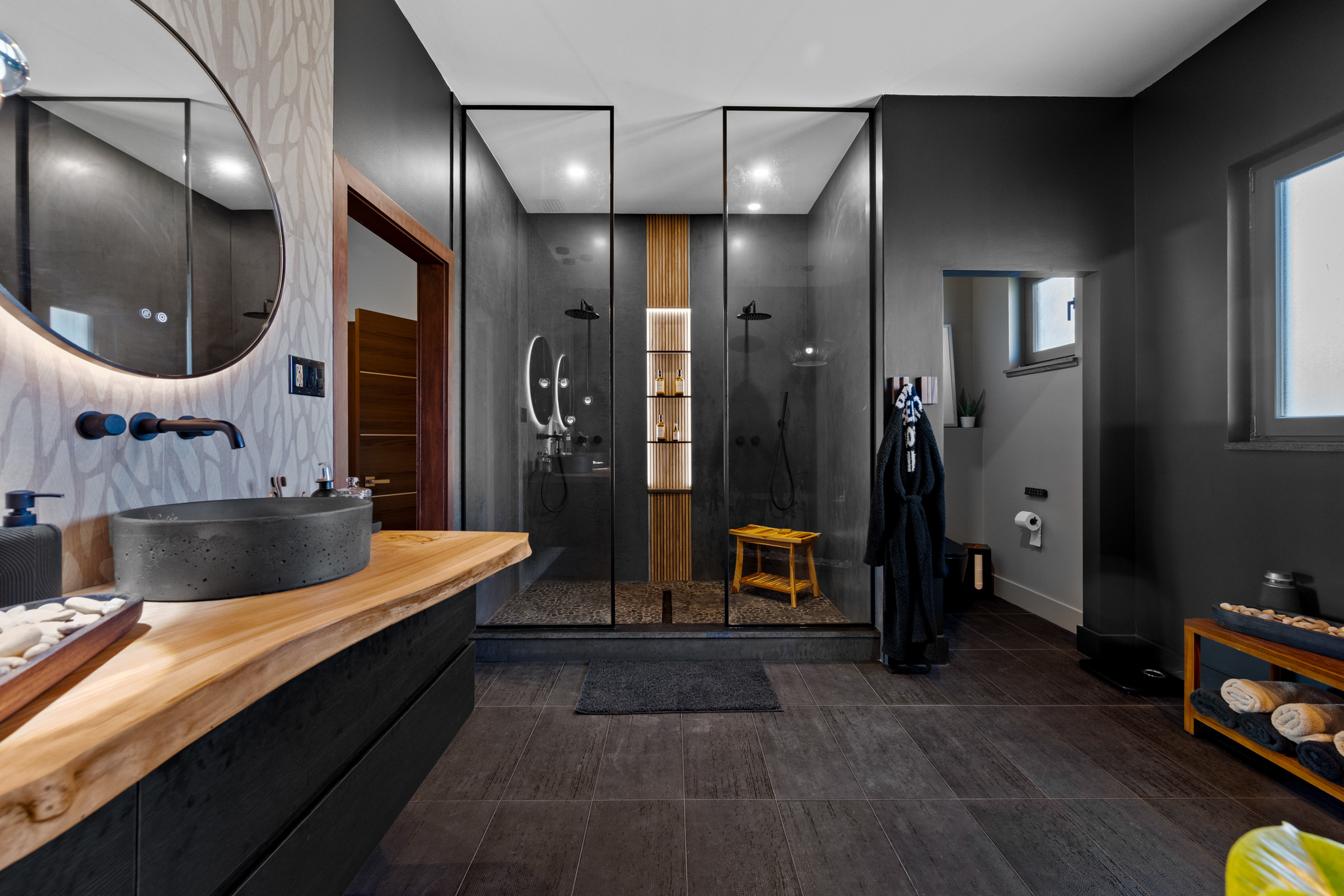 Moody, organic, and effortlessly luxurious. 🌿✨

This dark organic bathroom blends rich tones with natural textures to create a space that feels both grounding and sophisticated. Deep finishes, warm lighting, and earthy materials come together to transform the bathroom into a calming retreat.

Every detail is designed to balance bold darkness with natural softness—stone, wood accents, and minimal lines that let the materials speak for themselves. The result is a space that feels modern, serene, and deeply connected to nature.

Because great design isn’t just about how a space looks—it’s about how it makes you feel. 🖤

#OrganicDesign #DarkBathroom #MoodyInteriors #LuxuryBathroom #ModernOrganic #InteriorDesign #DesignInspiration 

 #LTKHome