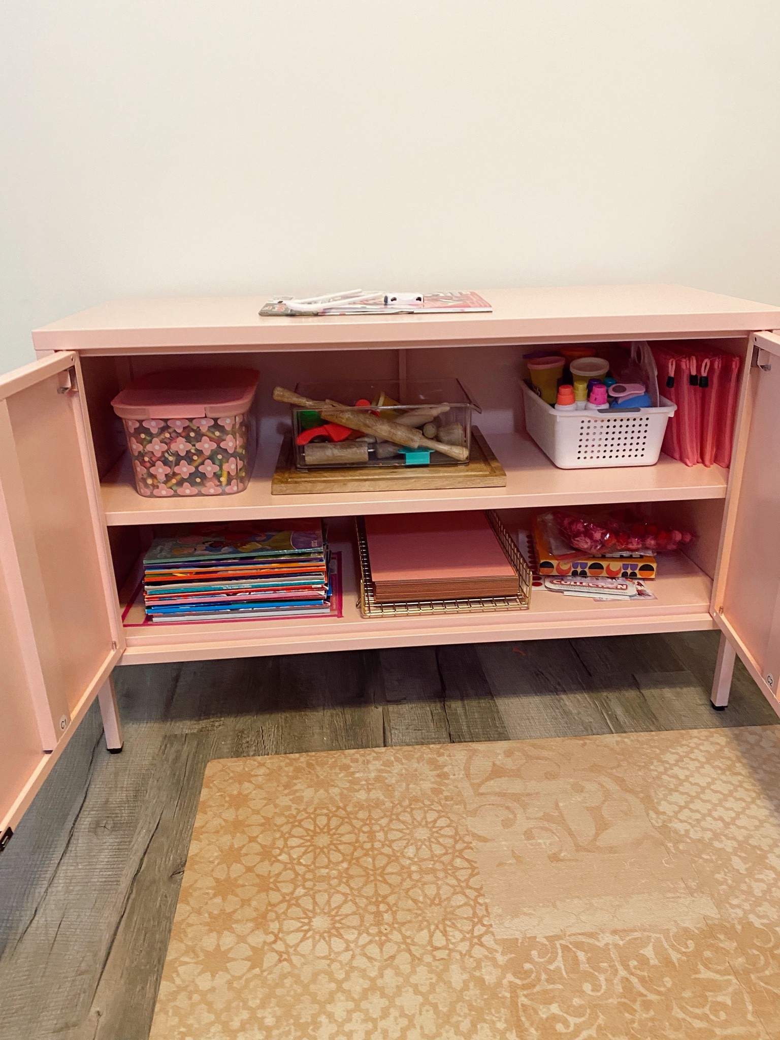This metal locker cabinet has been a life saver for us! I can organize all our craft supplies and it has handles that can easily have a child lock on them! #crafting #kids #toddler #home #playroom #organize #mom #cabinet #target

#LTKhome #LTKkids