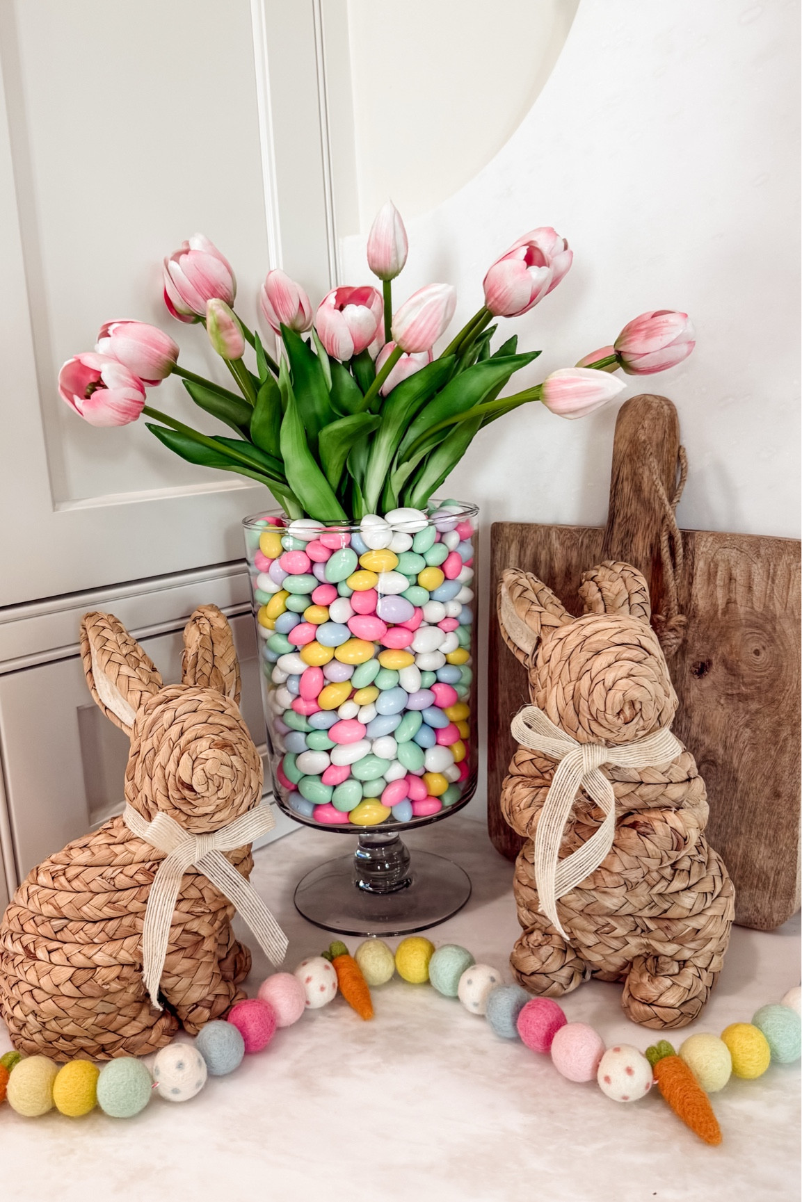 🍬Easter candy vase DIY🍬 love the pastel colors of these candies! They work perfectly in this vase. I added some tulips in the middle. Also, these rattan bunnies are adorable and so affordable. I also added one of my favorite spring/easter garlands and I love how it turned out! #easter #easterdecor #easterdiydecor #easterideas #rattanbunny 

#LTKHome #LTKSeasonal #LTKFindsUnder50