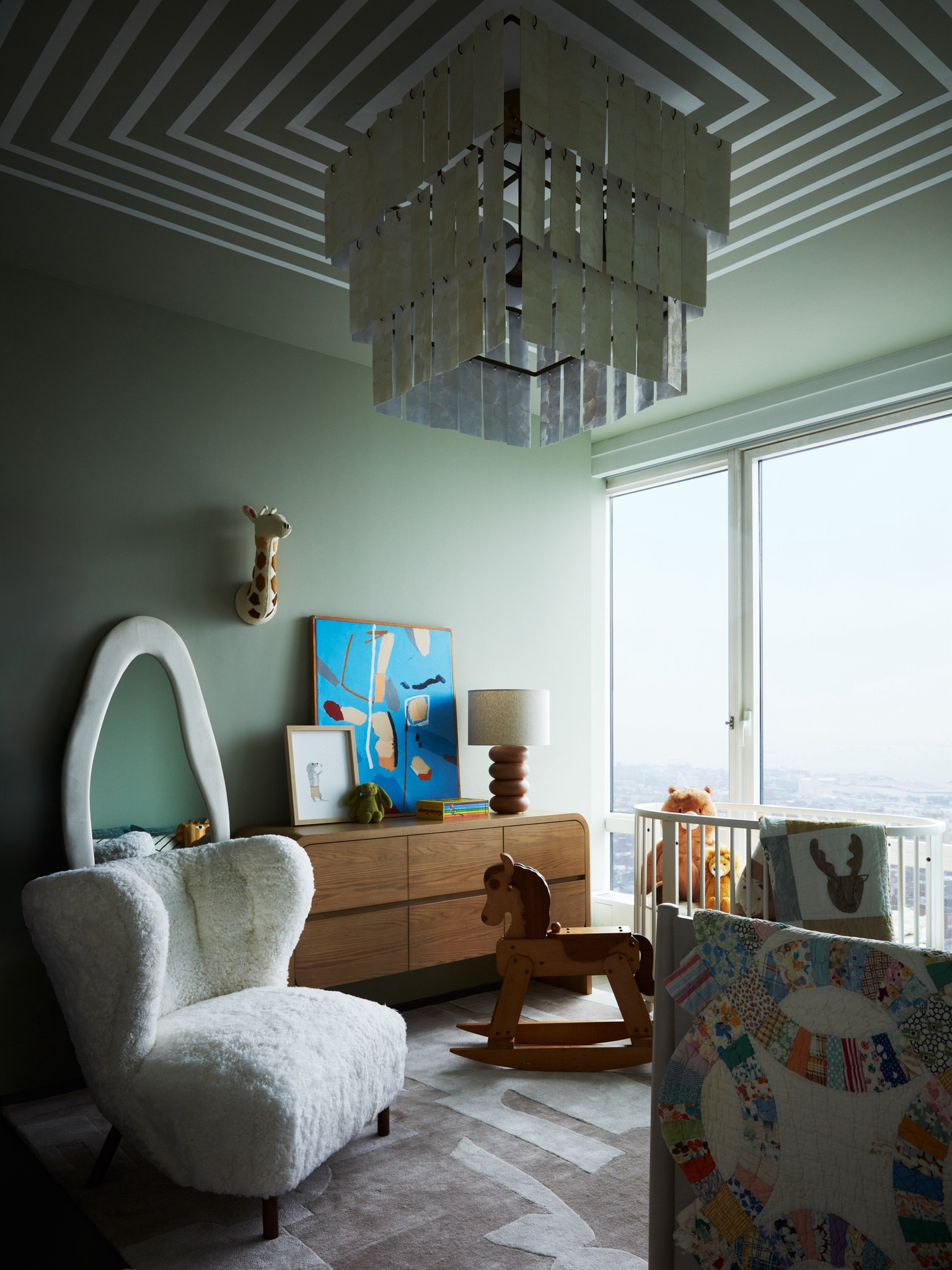 NURSERY REVEAL 🧸

Designing our home with my friend @csiriano has been such a joy. But designing baby Eric’s room was the most special room we created together. From the painted ceiling to the reuse to Trevor’s childhood rocking horse, the space brings me pure joy. Our home finally feels complete.

All the room details:
Carpet Jaipur Living
Chandelier CB2
Crib Stokke
Crib mattress Naturepedic
Dresser crate and barrel
Lamp Lulu and Georgia 
Felted giraffe head Fiona Walker
Mirror Salaterra
Quilt vintage
Rocking horse vintage 
Chair vintage 


#homedecor #interiordesign #nursery #babyroom #babiesroom #interior #decor #bedroomdesign #bedroominspo #bedroomideas #cleanaesthetic #design #mydomaine #nycapartments #nycapartment #apartmenttherapy #apartmentdecor #brooklynapartments #brooklynhomes

#LTKHome #LTKBaby
