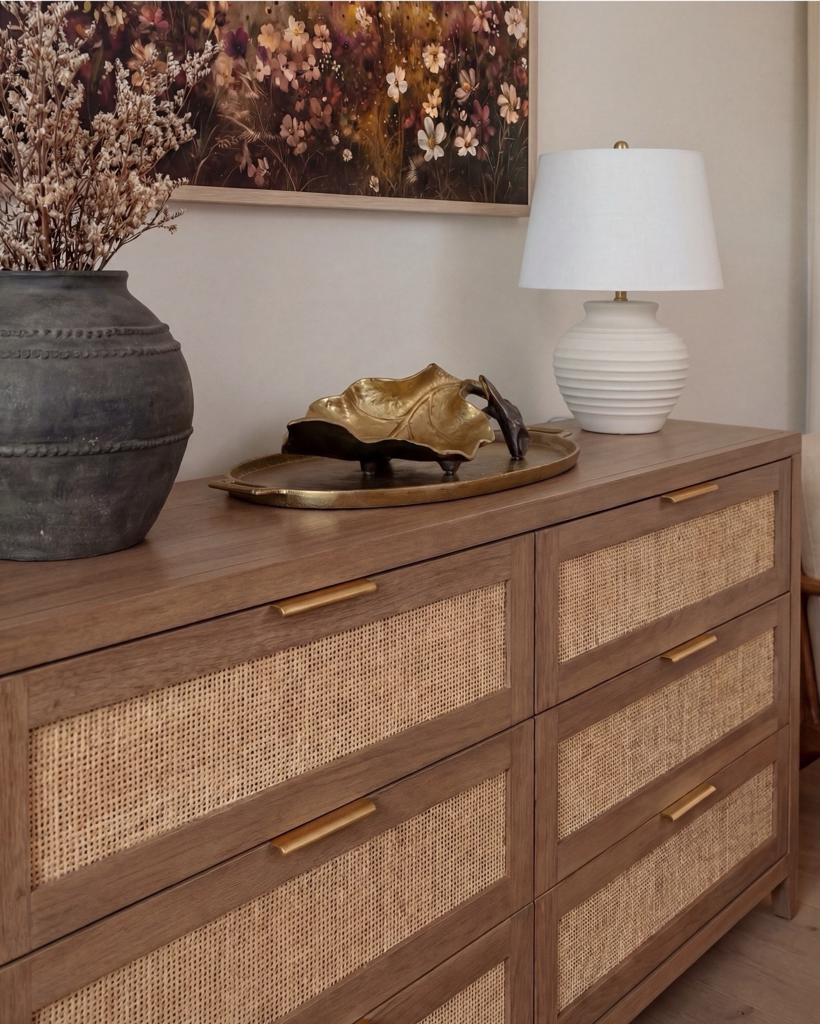 Shop the Look:
• Wood Woven rattan bed frame
• White upholstered mattress or box spring
• Black wood 3-drawer nightstands (set of 2)
• White duvet cover (hotel-style)
• White fitted sheet + pillow set
• Chunky knit throw blanket (beige or oatmeal)
• Neutral patterned accent pillow
• Brass globe wall sconces
• Cream ceramic table lamp with beige shade
• Large abstract landscape wall art (neutral tones)
•brown floral wall art
• Gold irregular curved scalloped wall mirrors
• Round woven knit poufs
• Neutral geometric or diamond area rug
• Large white ceramic vase
• Small decorative bowl (white or stone)
• Ivory linen curtain panels
•wood upholstered accent chair 
•black terracotta vase
•wood rattan dresser
•brass decor tray
•black leaf decor bowl 
•decor books
#LTKSaleAlert

#LTKsale #LTKhome #LTKstyletip