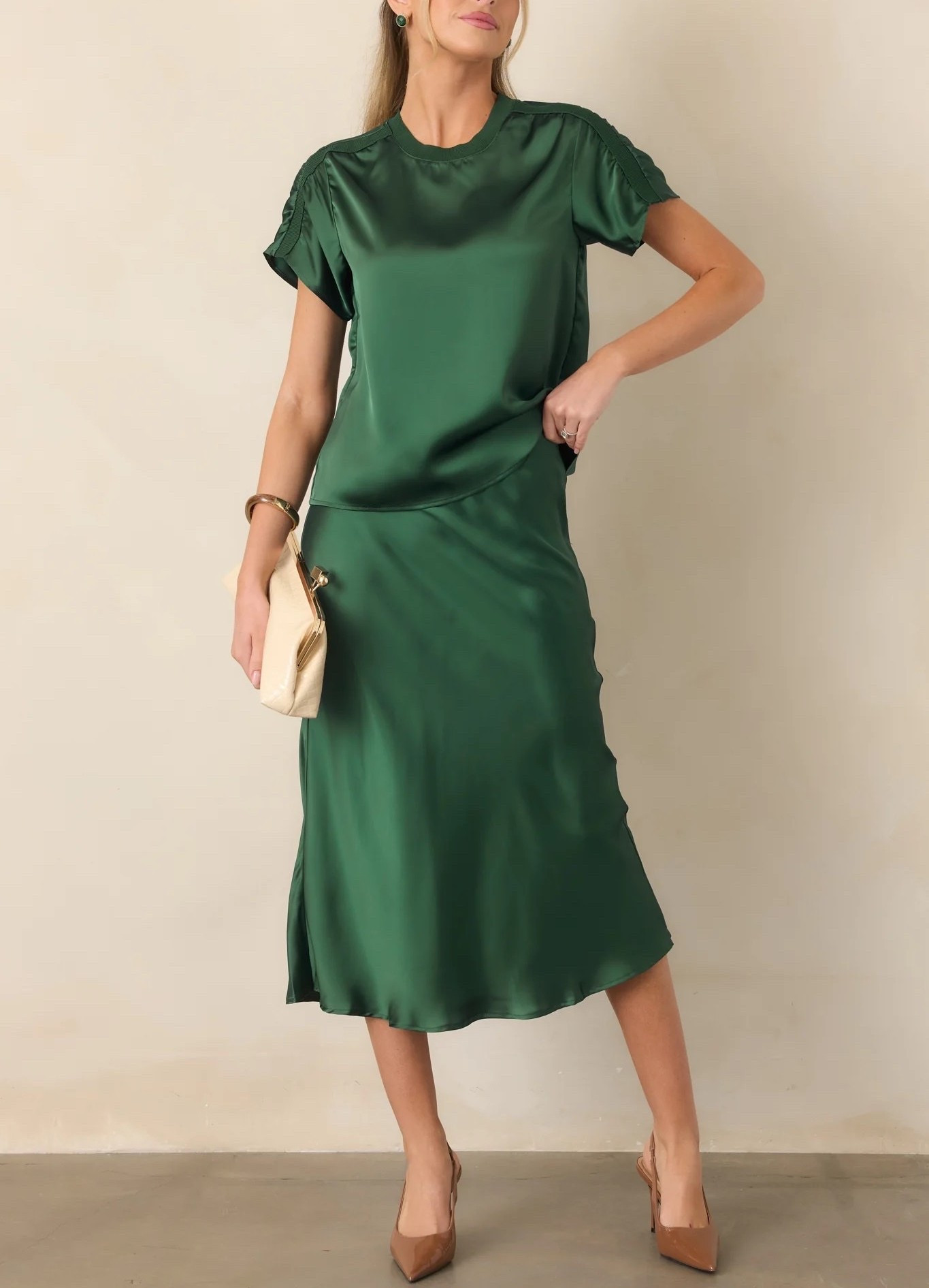 The Vibe Check Emerald Green Satin Contrast Trim Top & Satin Midi Skirt create an effortlessly polished two-piece look in a rich emerald green satin. The contrast trim adds a refined detail to the softly lustrous fabric, while the coordinating midi skirt creates an elegant, elongated silhouette. Wear the set together for a sophisticated evening look or style each piece separately for more versatility. Top: Under $60; Skirt: Under $80.

Ideas:

* elegant evening look
* sophisticated matching set
* dinner date outfit
* holiday party style
* elevated fall fashion

Keywords:

* emerald green set
* emerald green outfit
* satin matching set
* satin two piece set
* emerald satin top
* satin midi skirt
* emerald green midi skirt
* emerald green blouse
* matching top and skirt
* two piece outfit
* fall wedding guest
* holiday party outfit
* dinner outfit
* elegant evening outfit
* women’s fashion

#LTKootd #LTKWedding #LTKTravel