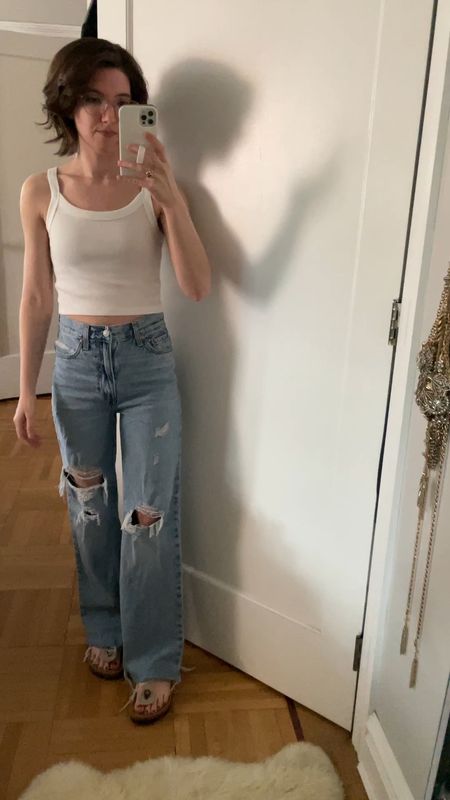 Cropped Tank: TTS
Levi’s ribcage high waisted wide leg jeans : TTS. I chopped about an inch off the bottom 
Birkenstock Look alikes: TTS

#LTKStyleTip