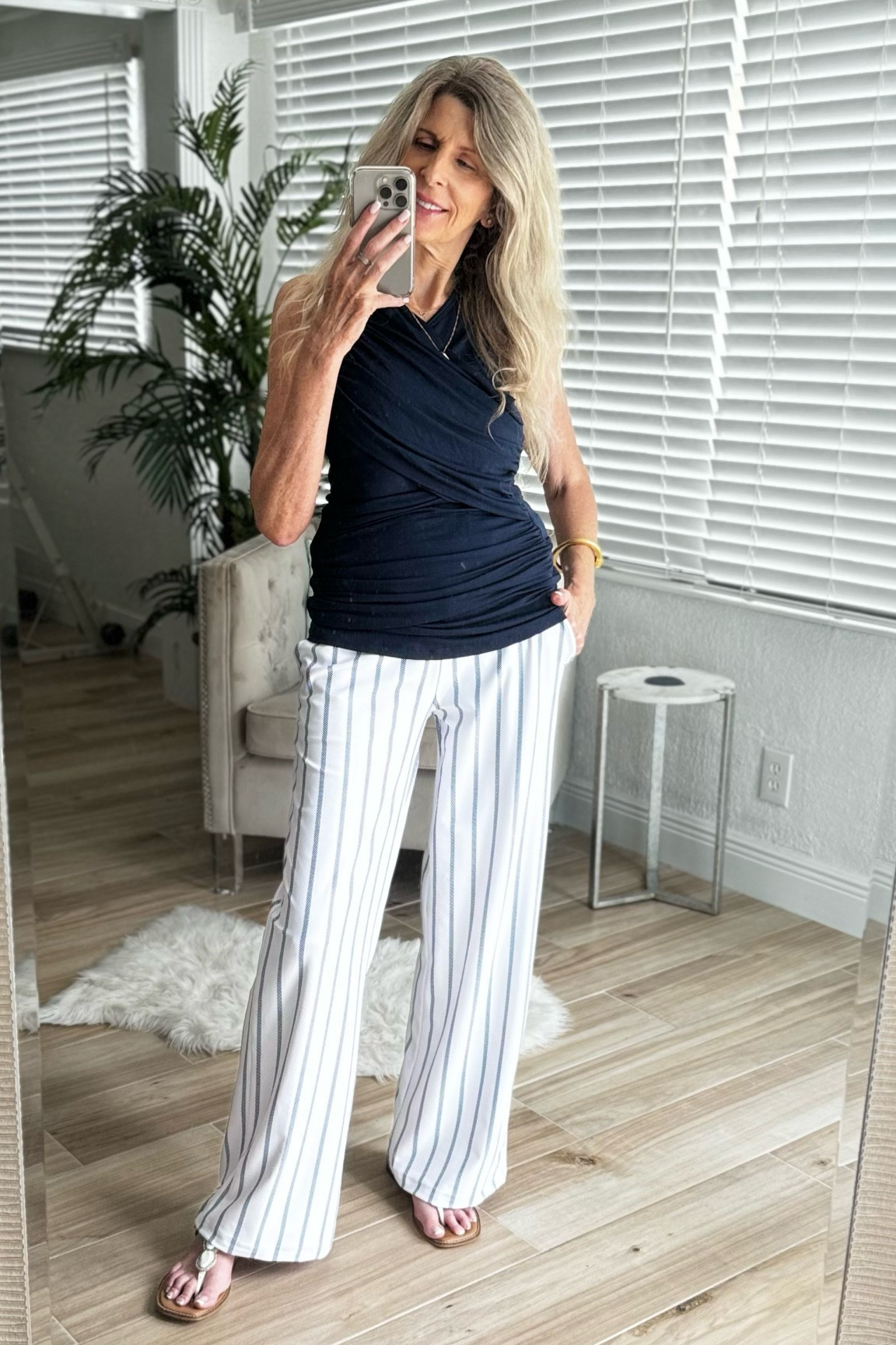Wide leg pants are super stretchy & comfy & have pockets. Pinstripes are in! High waisted. Perfect for traveling, date night, girls night, or work. Rouched navy top. Add a wrap to transition to Fall. 