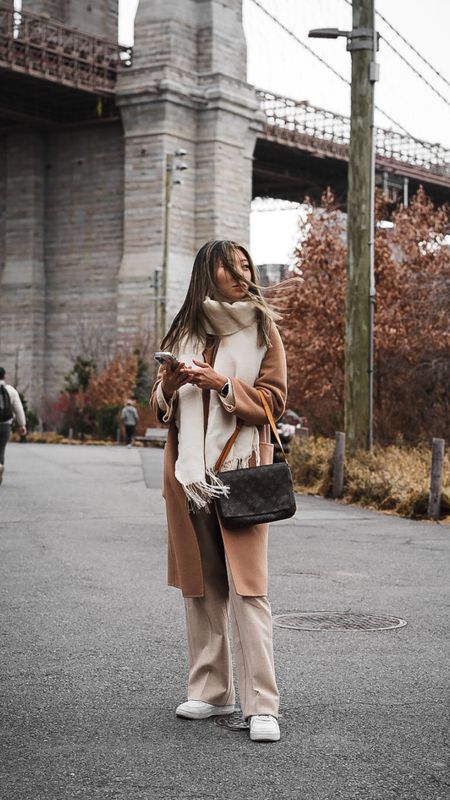Neutral monochrome winter outfit in NYC // Outfit details: wool coat from shop the curated, oversized scarf from h&m, sweater from toteme, wide leg pants from aritzia, sneakers from nike, bag is vintage louis vuitton // winter outfit, cold weather style, new york city fashion, wool coat, camel coat, petite style, neutral aesthetic, wide leg pants

#LTKstyletip #LTKworkwear #LTKFind