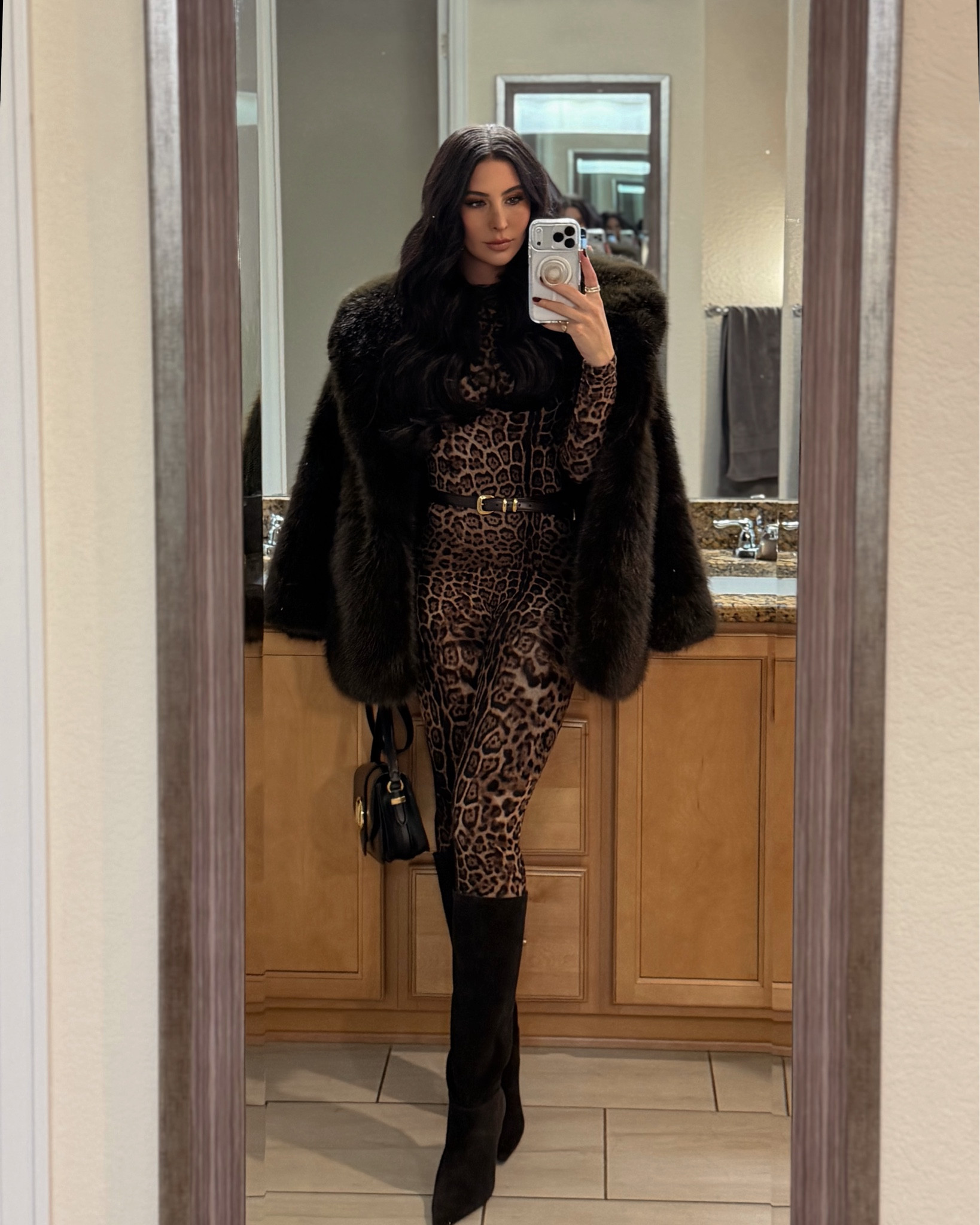 OOTN, leopard jumpsuit paired with a brown belt, brown suede boots, and a cropped faux fur for a girls dinner.

#LTKBeauty #LTKgrwm #LTKootd