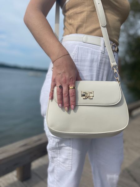 White purse and gold ring. Amazon finds. Purse comes with two straps! Ring is also available in rose gold and silver. 

#LTKfindsunder50 #LTKGiftGuide #LTKfindsunder100